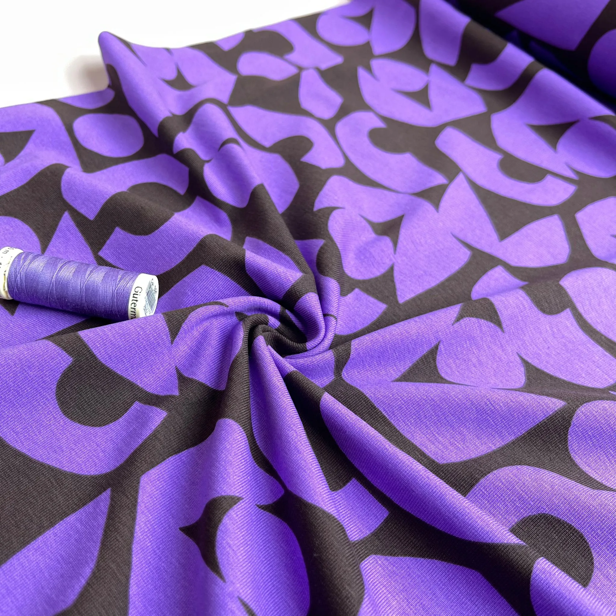 Purple Shapes on Brown Combed Cotton Jersey Fabric