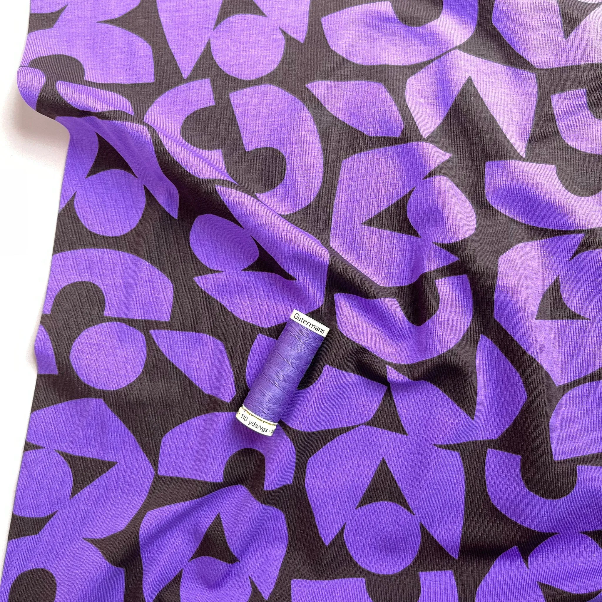 Purple Shapes on Brown Combed Cotton Jersey Fabric