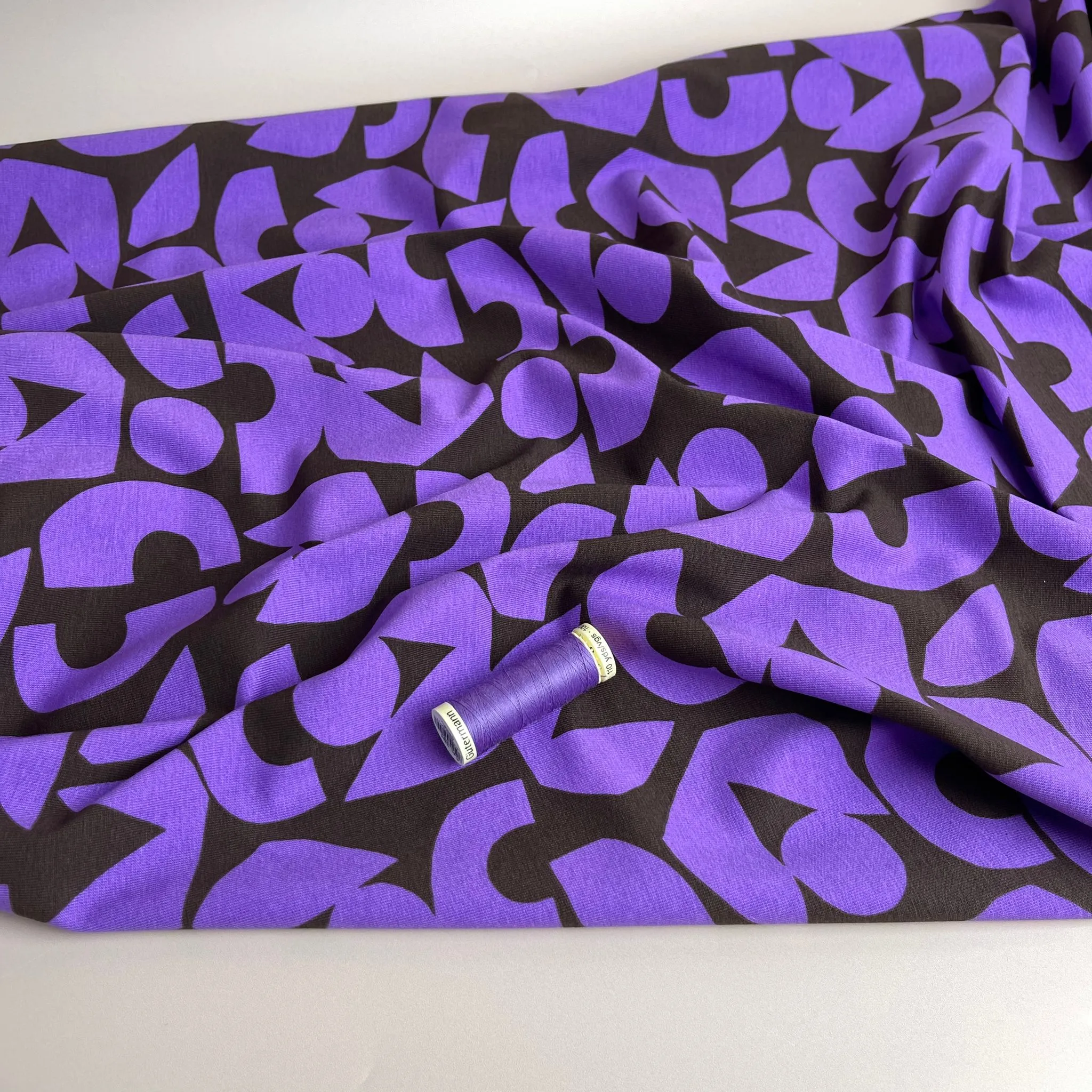 Purple Shapes on Brown Combed Cotton Jersey Fabric